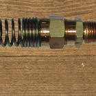 Coupler Assembly with Spring Gaurd